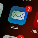 Email inbox on laptop representing CVE-2026-42897 Microsoft Exchange Server OWA cross-site scripting zero-day actively exploited in the wild