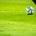 Stadium crowd representing FIFA World Cup 2026 cybersecurity fraud phishing fake domains banking malware ticket scams FBI warning